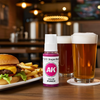 An overlarge representation of a 17ml bottle of paint, among 32oz glasses of beer, and a Cheeseburger plate with Fries, in the setting of an American Bar & Grill